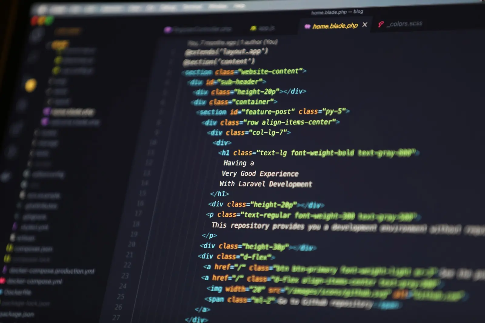Website code open in an editor on a laptop screen